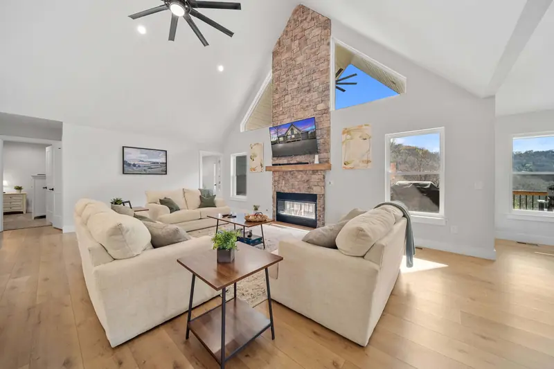 Spacious living room with fireplace at Norris Lake property